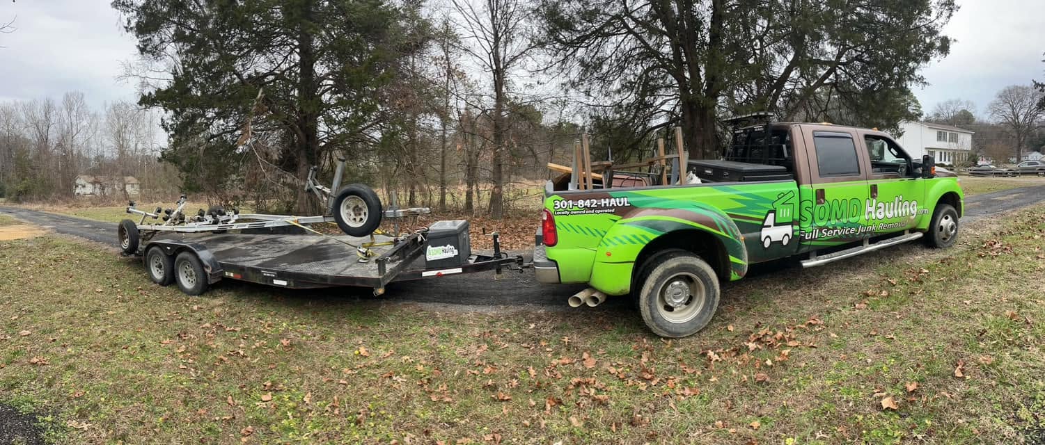 Branded truck towing a loaded trailer