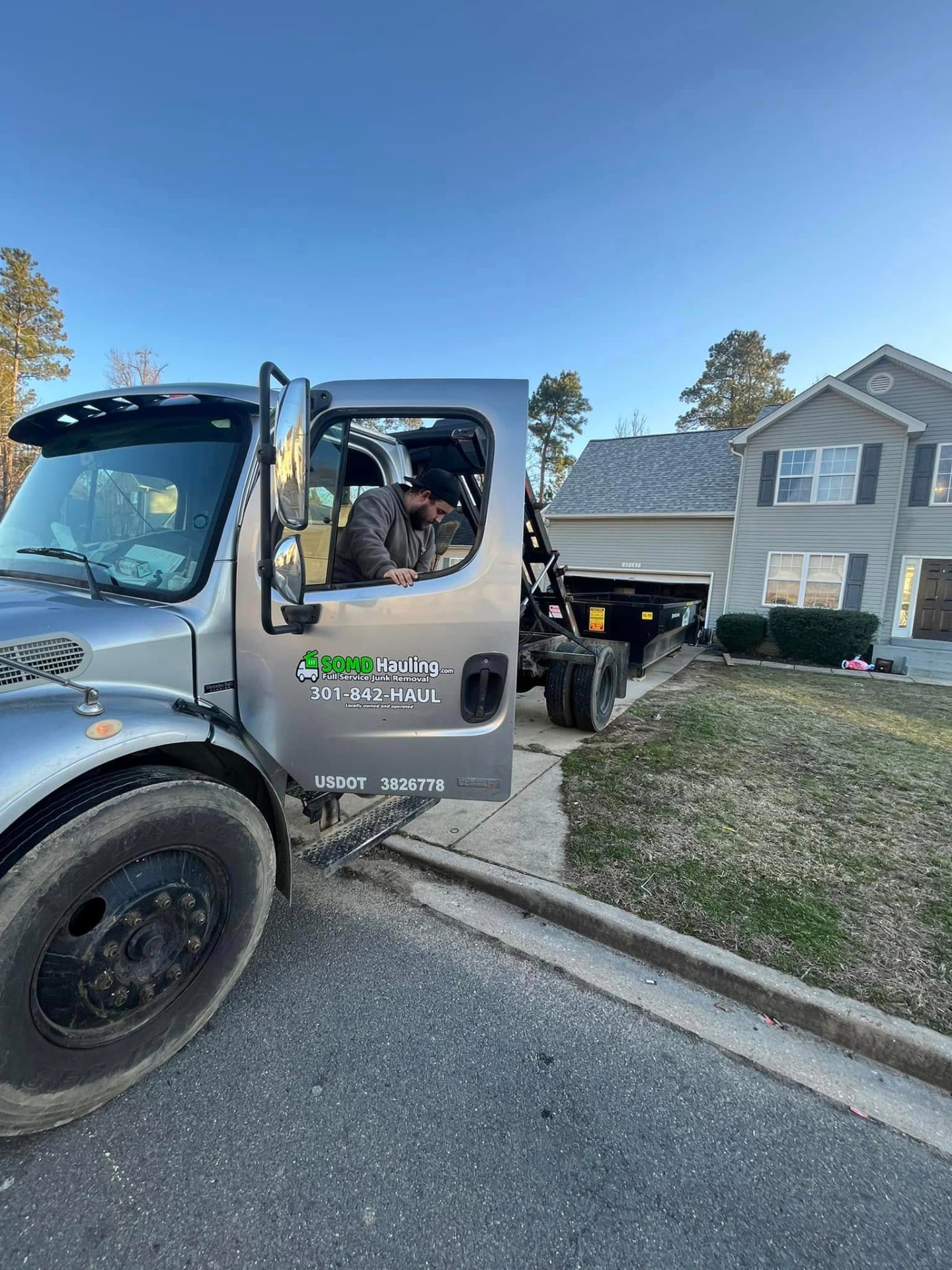 A 15-yard bin on a fresh driveway — and not one mark left behind.